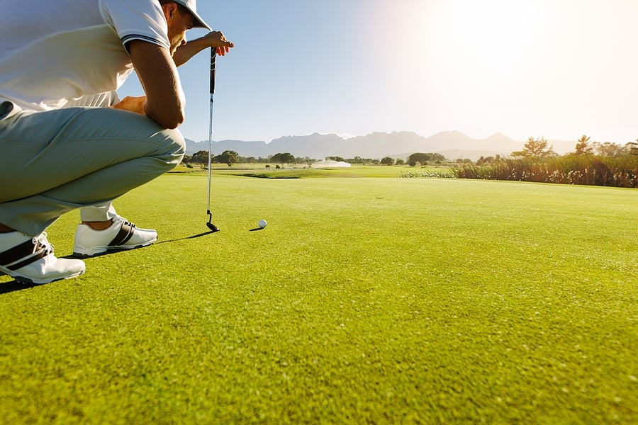 bigstock-Pro-Golf-Player-Aiming-Shot-Wi-182077552